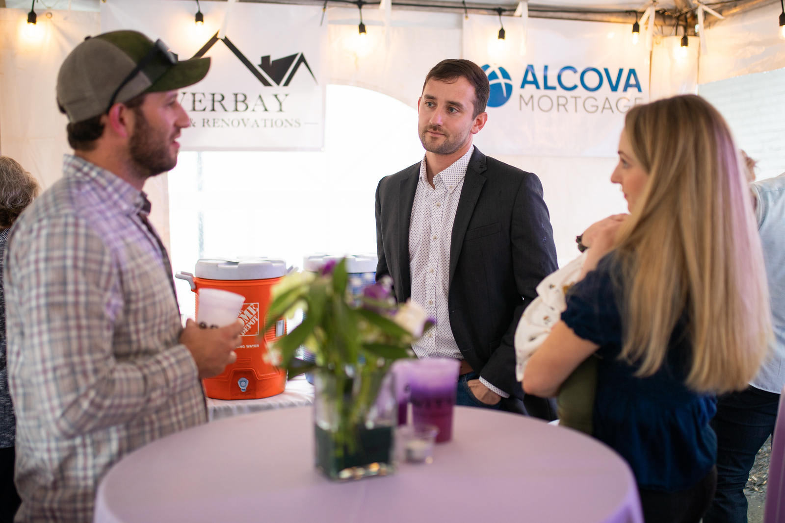 Gravity agents chatting at a vendor networking event